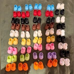 Brand New Set of 45 Pairs of Assorted Labubu BIE/MAC Hard Plastic Shoes